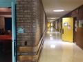 Colorful doors and low maintenance natural brick and wood are throughout the building. The horizontal wood is so little kids wouldn't scrape the bricks, which are rounded at the corner.