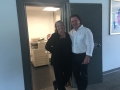 Amy and Joe pose in front of a former vault, now a copier room