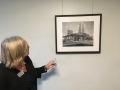 Amy shows some photography in the bank's lower level