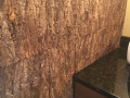 Natural cork on the powder room wall