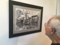 Don Wrobleski looks at a sketch of the house