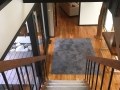 The stairs lead to from the foyer to the master suite bridge and bedroom level
