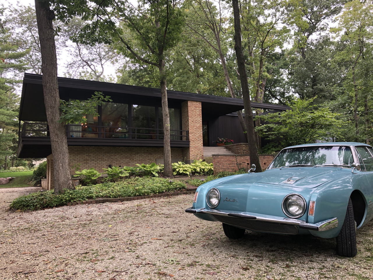 The owners' 1963 Studebaker Avanti, parked in front of their gorgeous - and very original - 1965 MCM home in Lake Forest