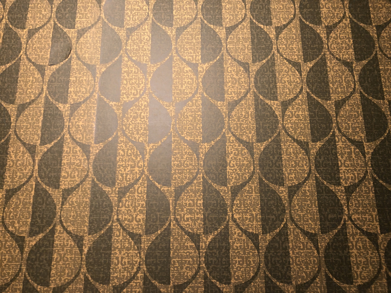 The only wallpaper in the house is in the coat closet...what a pattern!