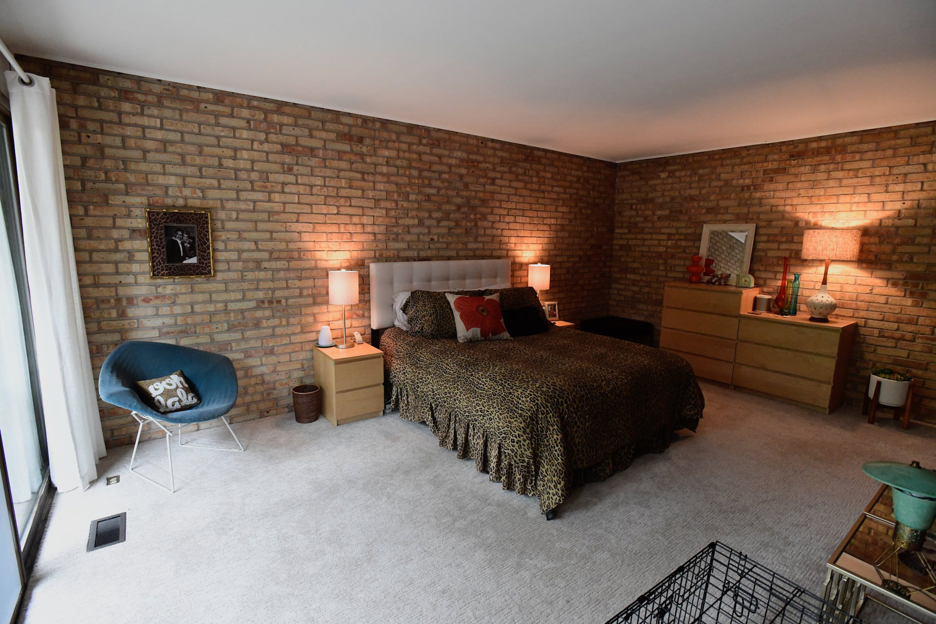 Exposed brick and wood walls (off camera) make for a very comfortable and cozy master suite